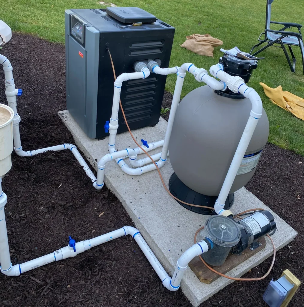 Pool pumping system sitting on concreate slab installed by PBK's residential pool services
