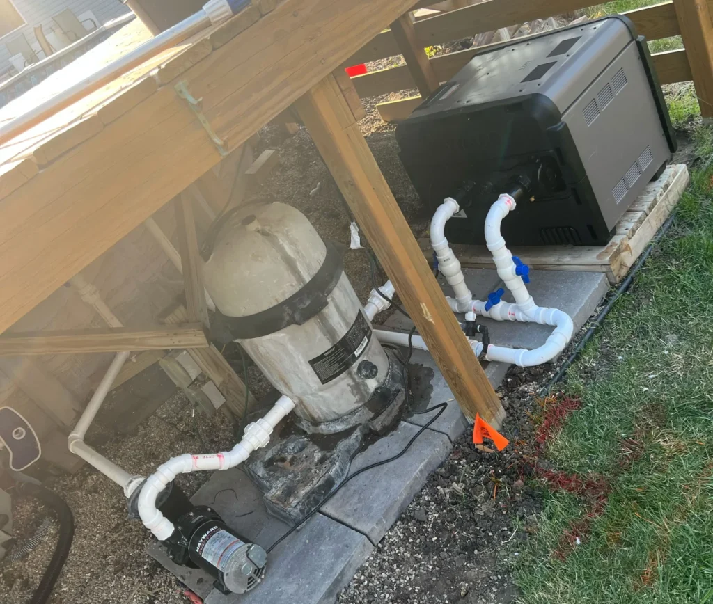 Pool pump installed under a deck by PBK's residential pool services