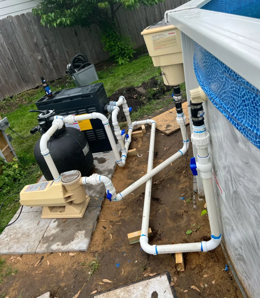Pool pump system mounted on concrete base, installed by PBK’s residential pool services team